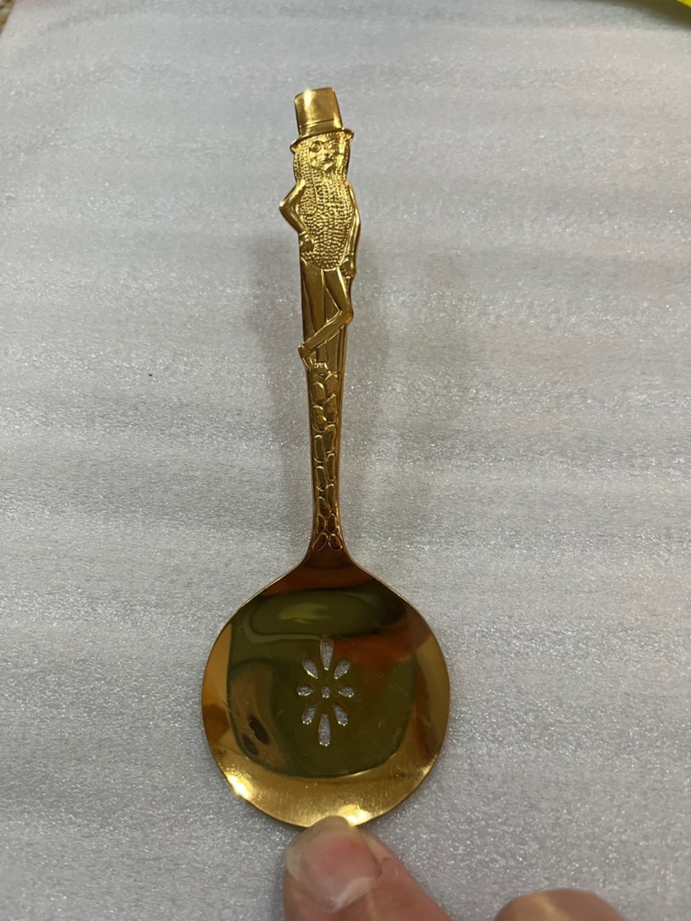 Vintage gold tone Mr Peanut slotted spoon